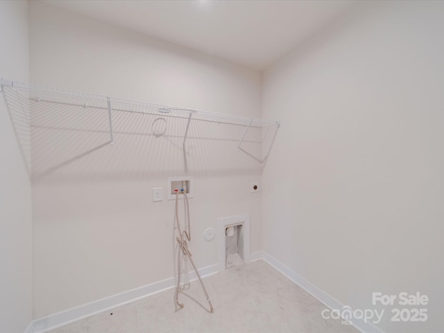 clothes washing area with hookup for a gas dryer, laundry area, washer hookup, baseboards, and electric dryer hookup