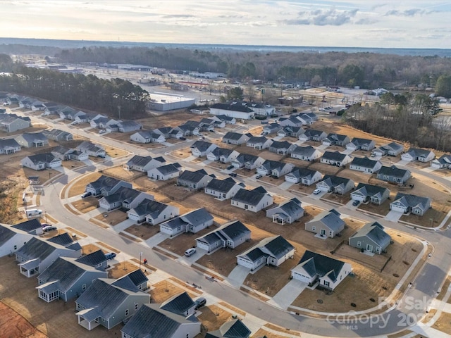 birds eye view of property with a residential view