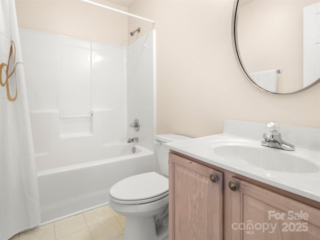 full bath featuring toilet, tile patterned flooring, shower / bath combo, and vanity