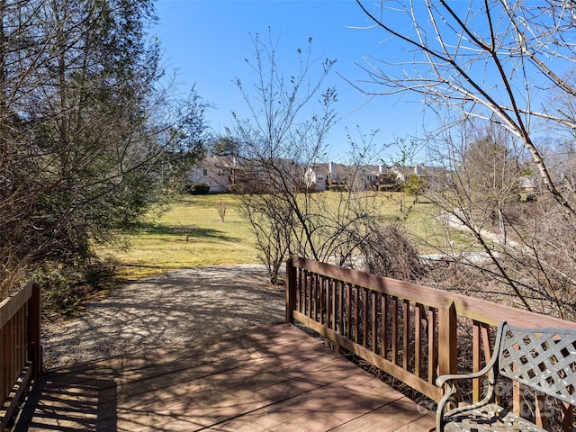 wooden deck with a yard