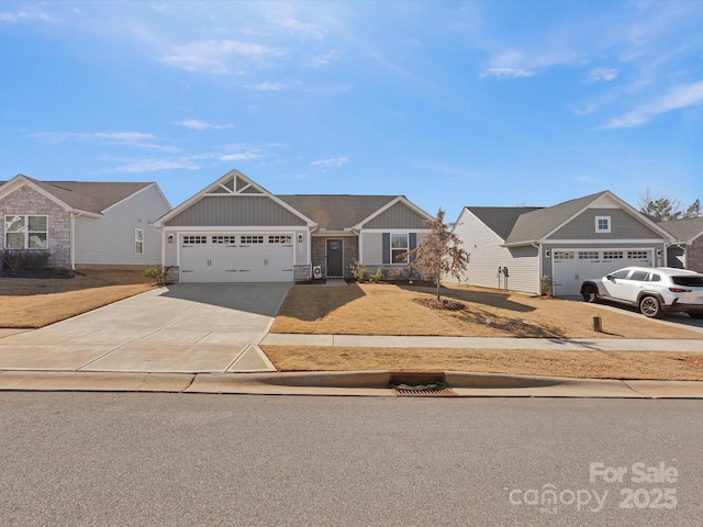 craftsman house with driveway, an attached garage, and board and batten siding