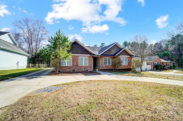 view of front of home featuring brick siding, fence, concrete driveway, crawl space, and a front lawn