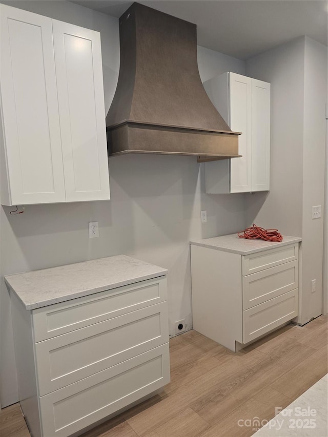 44389 US-52 Hwy N, Richfield, NC 28137 - kitchen with custom range hood, light wood-type flooring, and white cabinets