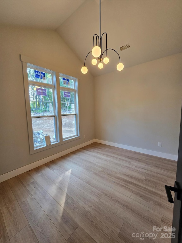 44389 US-52 Hwy N, Richfield, NC 28137 - spare room with lofted ceiling, wood finished floors, a chandelier, and baseboards