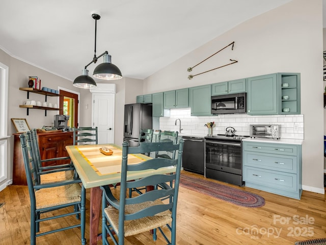 1973 Buffalo Creek Rd, Lake Lure, NC 28746 - kitchen with open shelves, decorative backsplash, a sink, and black appliances