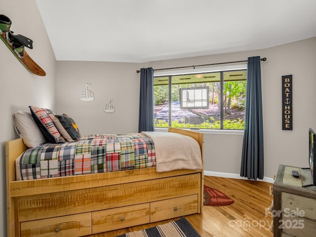 1973 Buffalo Creek Rd, Lake Lure, NC 28746 - bedroom featuring wood finished floors and baseboards