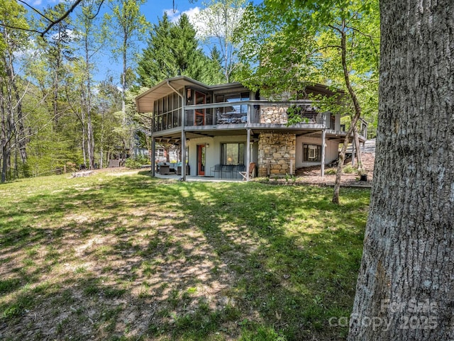 1973 Buffalo Creek Rd, Lake Lure, NC 28746 - back of house featuring a yard, a chimney, a patio area, and stone siding