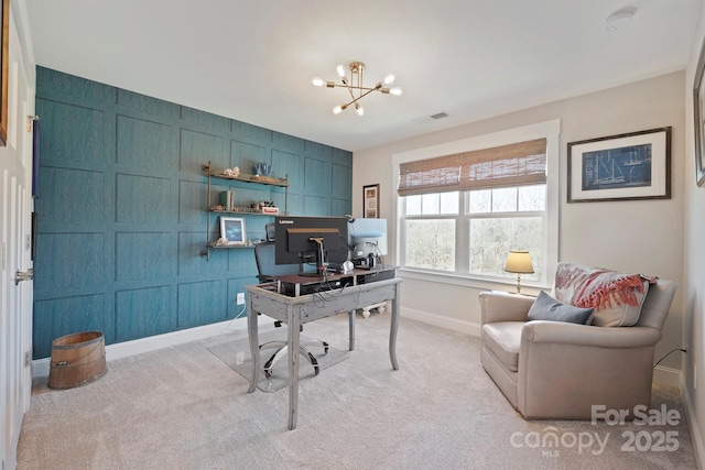 home office featuring light carpet, baseboards, visible vents, and a notable chandelier