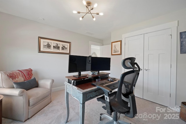 office featuring light colored carpet, baseboards, and an inviting chandelier