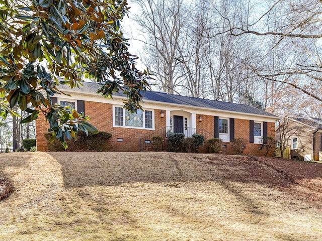 ranch-style house featuring crawl space and brick siding