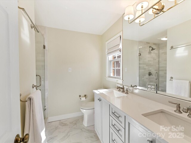 full bath with a shower stall, toilet, marble finish floor, and a sink