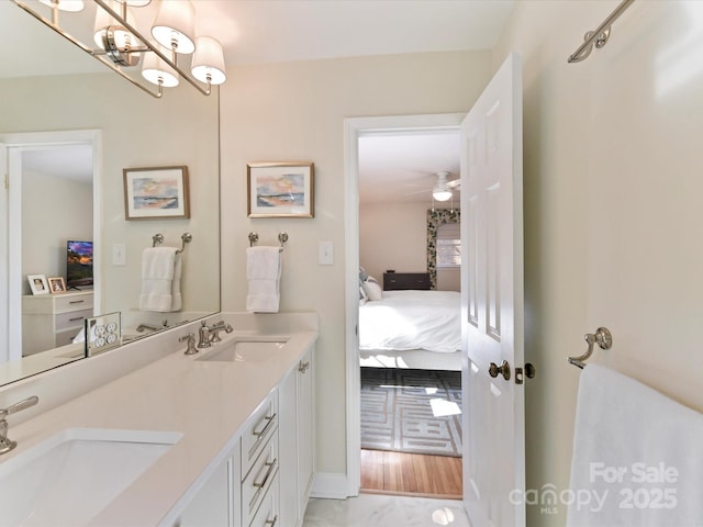 full bath featuring double vanity, ensuite bath, and a sink