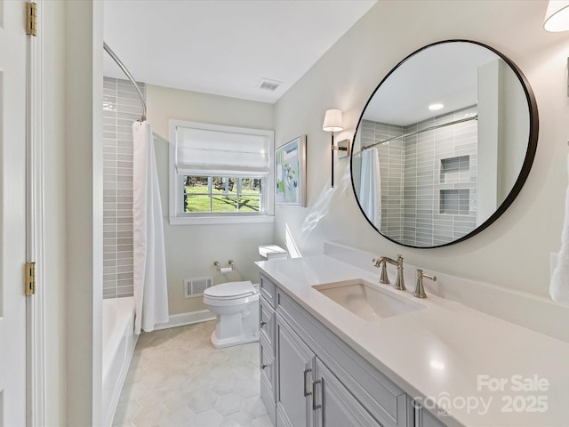 full bathroom featuring visible vents, toilet, vanity, and tile patterned flooring