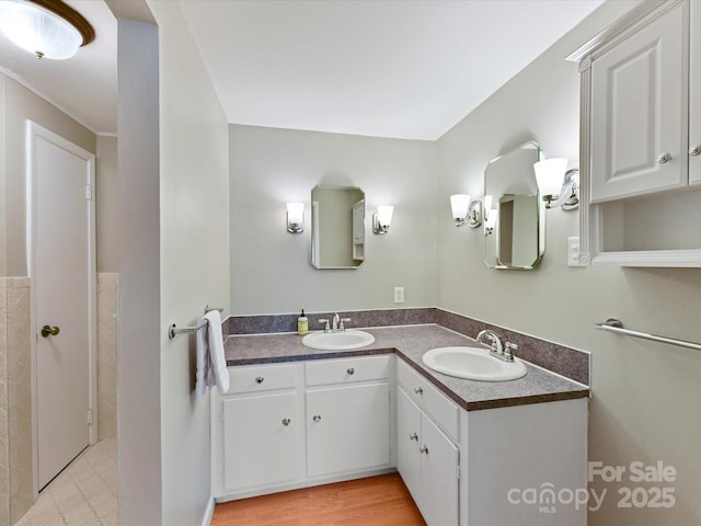 bathroom with vanity and wood finished floors