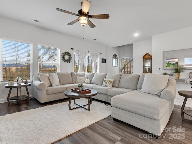 living area featuring a ceiling fan, visible vents, dark wood-style flooring, and recessed lighting