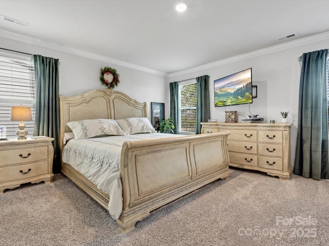 bedroom featuring light colored carpet, visible vents, and crown molding