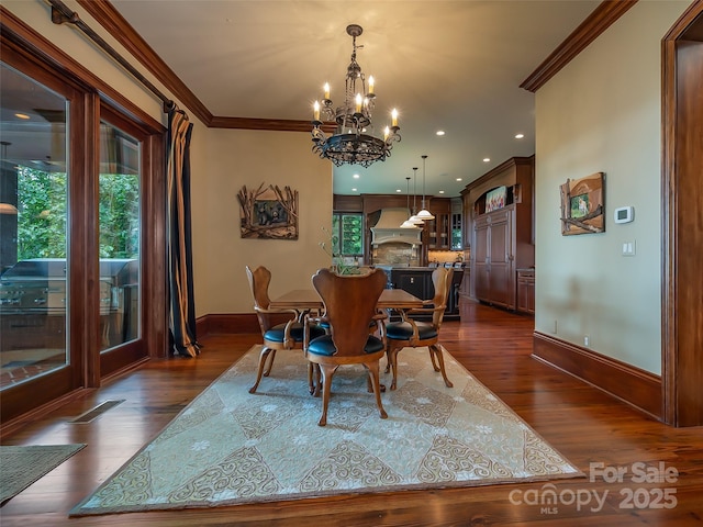 dining area with baseboards, dark wood finished floors, and crown molding