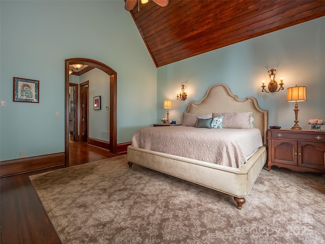 bedroom with wooden ceiling, baseboards, arched walkways, and high vaulted ceiling