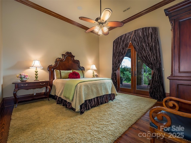 bedroom with access to outside, visible vents, crown molding, and wood finished floors