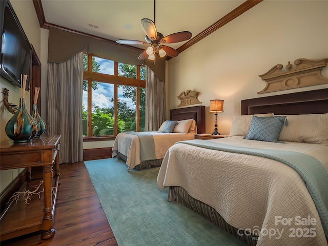 bedroom featuring ceiling fan, ornamental molding, dark wood-style flooring, and visible vents