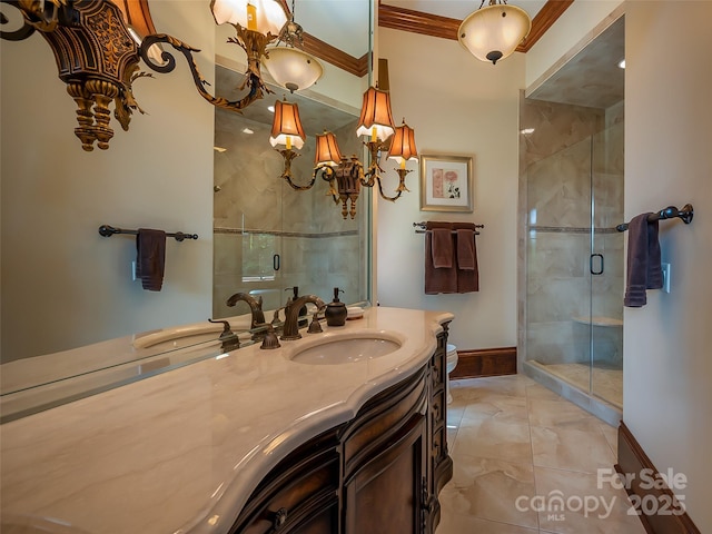 bathroom with a stall shower, baseboards, ornamental molding, and vanity