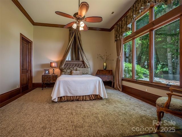 bedroom with visible vents, ornamental molding, a ceiling fan, and baseboards