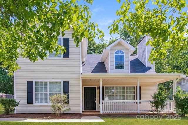 view of front of home with covered porch and a chimney