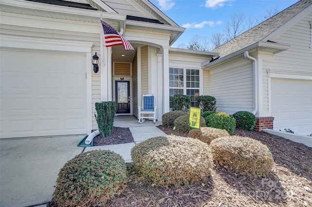 doorway to property with an attached garage