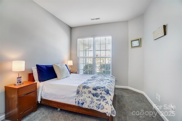 bedroom with carpet floors, visible vents, and baseboards