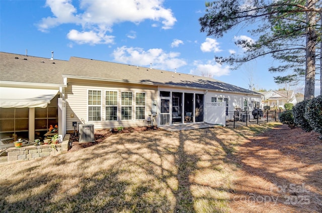 back of property with a patio and fence