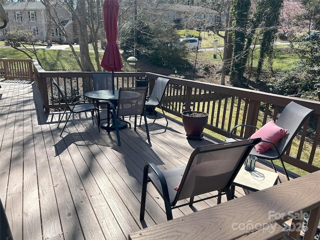 wooden deck featuring outdoor dining space