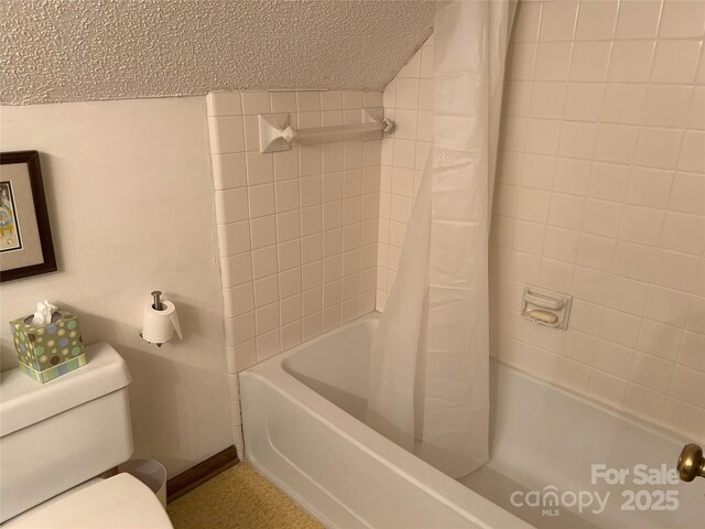 full bath featuring shower / bath combo with shower curtain and toilet