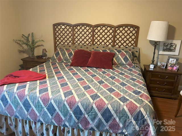 bedroom with wood finished floors