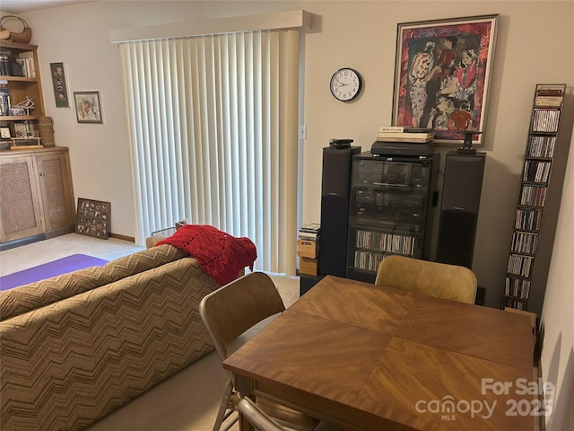 carpeted bedroom featuring baseboards