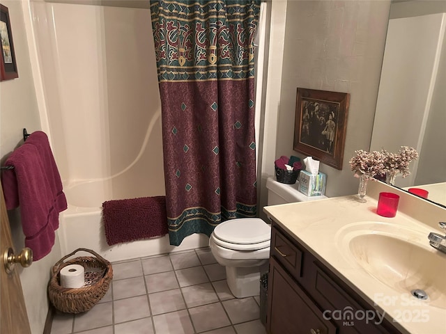 full bathroom featuring tile patterned flooring, shower / bathtub combination with curtain, toilet, and vanity