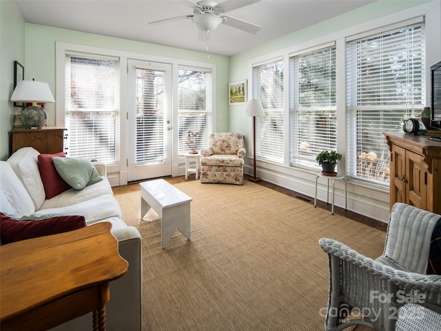 sunroom featuring ceiling fan and visible vents