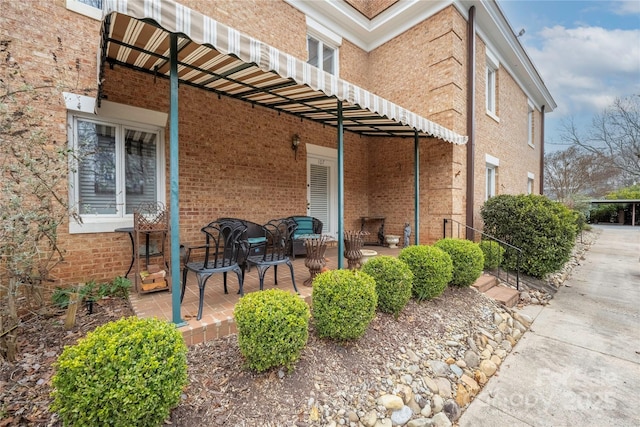 view of home's exterior featuring a patio and brick siding