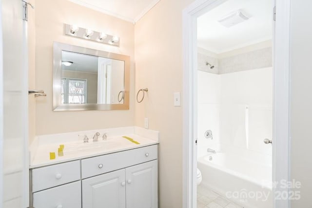 full bath featuring toilet, vanity, ornamental molding, and shower / bathing tub combination