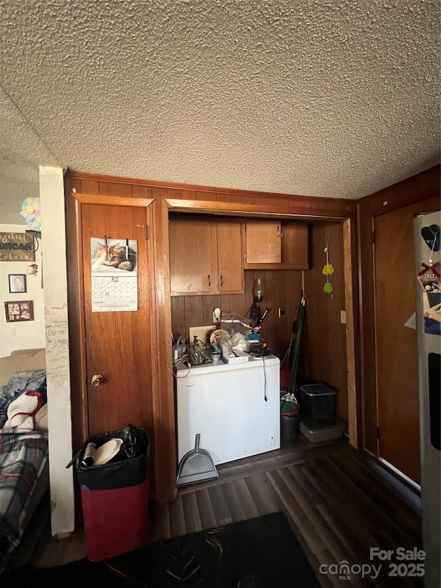 laundry area with washer / dryer and wood walls