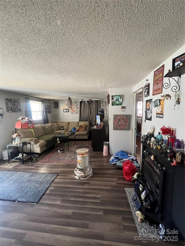 living room featuring a textured ceiling and wood finished floors