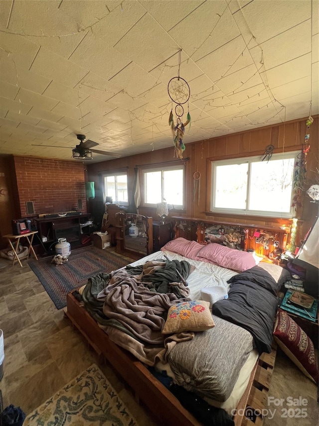 bedroom with wood walls