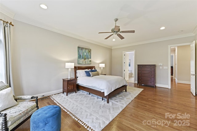 bedroom featuring recessed lighting, baseboards, wood finished floors, and ornamental molding