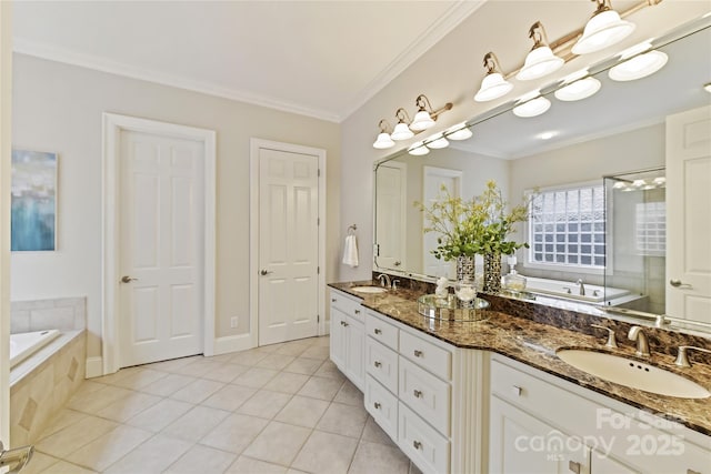 full bathroom with tile patterned flooring, ornamental molding, a bath, and a sink