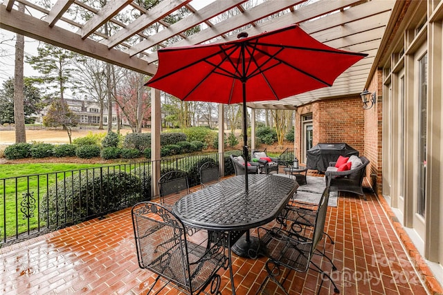 view of patio / terrace featuring grilling area and a pergola