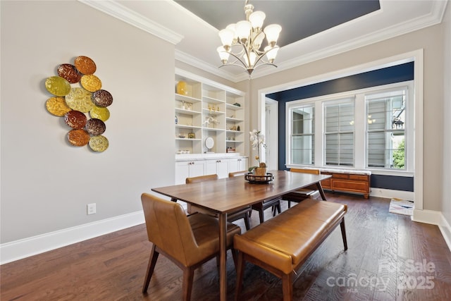 dining area featuring baseboards, dark wood-style flooring, and ornamental molding