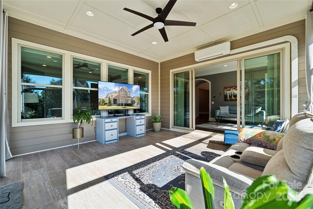 view of patio with ceiling fan, an outdoor hangout area, and a wall mounted air conditioner