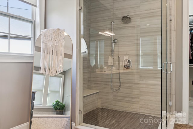 bathroom with a shower stall