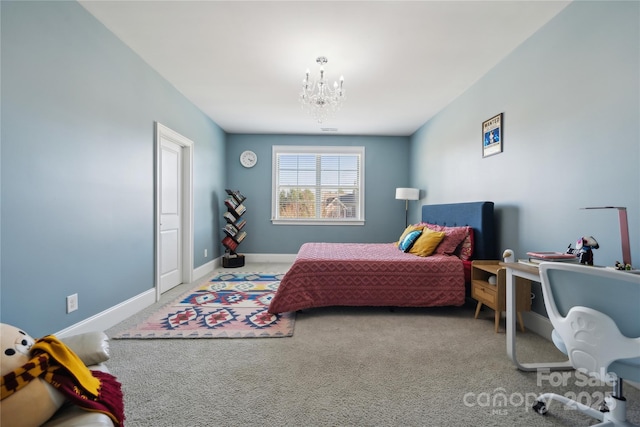 carpeted bedroom featuring a chandelier and baseboards