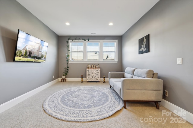 living area with baseboards and recessed lighting