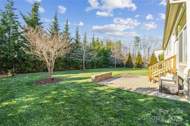 view of yard with a patio and fence